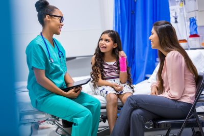 The 28 Most In-Demand Nursing Jobs of 2022 - a picture of a nurse treating a young female patient with a broken arm.