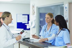 Conflict Resolution in Nursing- picture of nurses speaking with a doctor