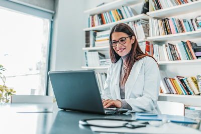 Doctoral nurse working, DNP vs. phd