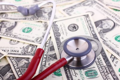 stethoscope on money