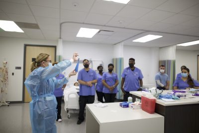 Professor Doing PPE Exercise