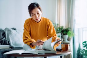 Attack Your Day! Before it Attacks You - a picture of a young woman studying.