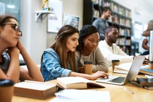 Graduate Support in the Virtual Library - a picture of a young women studying together.