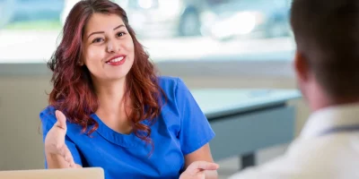 a nurse answering questions in a job interview