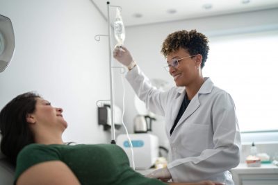 Nurses and the Brave New World of Psychedelic-Assisted Therapies - picture of woman receiving IV therapy