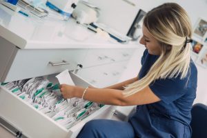 Administrative Healthcare Career Guide - a picture of a healthcare administrator filing paperwork.