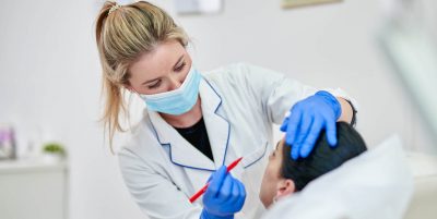 Aesthetics Nurse: A Comprehensive Guide - a picture of an aesthetic nurse administering a treatment.
