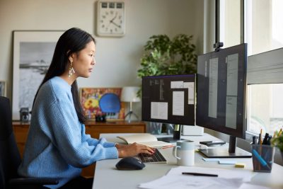 Productivity Hack- Deep Learning - a woman sitting at her desk working hard